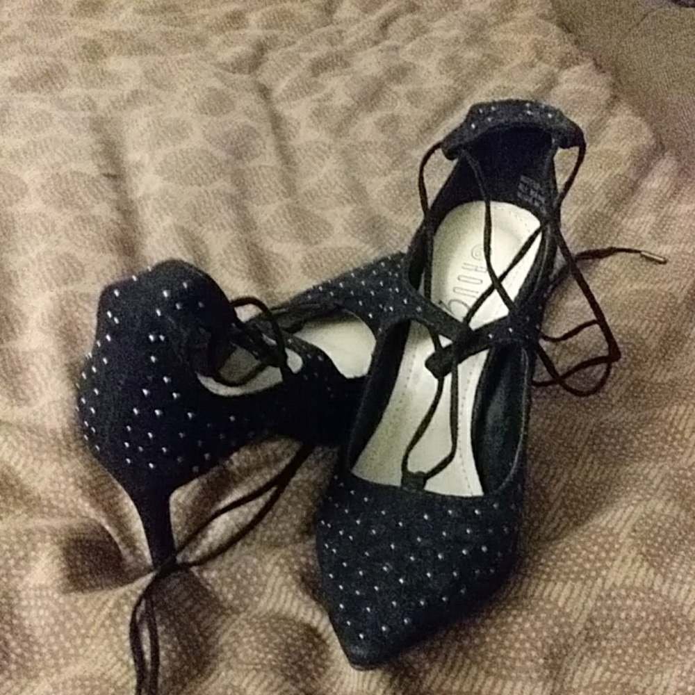 Black studded stappy stilettos.